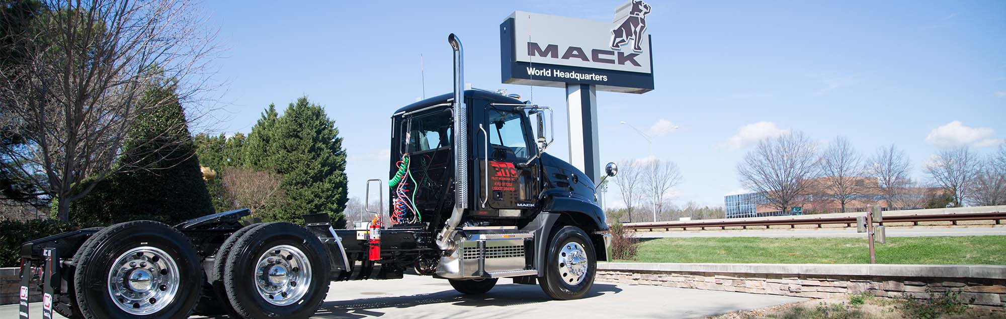 Black Transport Truck and MACK Sign